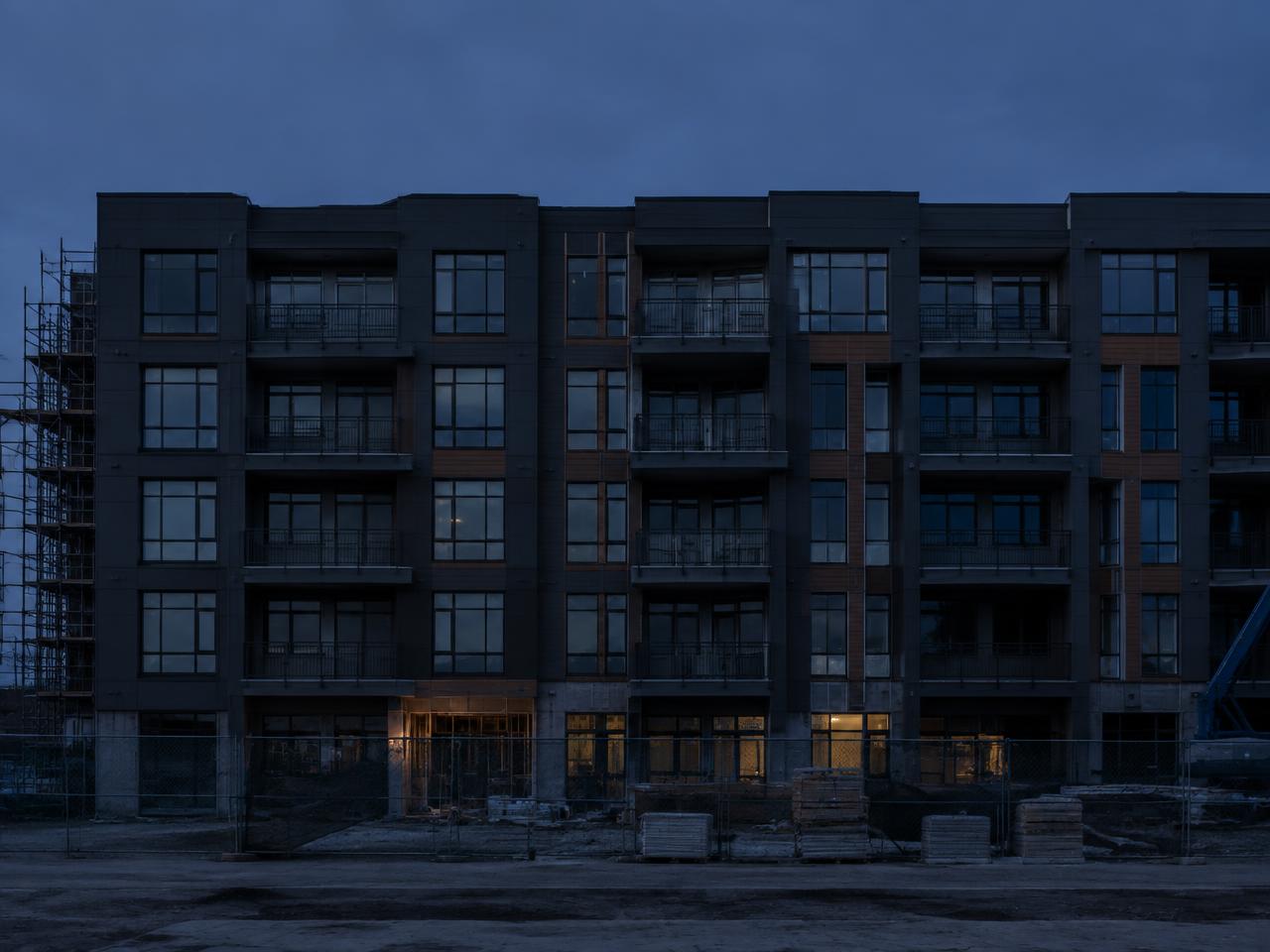 Multifamily property under construction at dusk